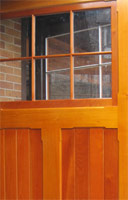 The Spanish Cedar was clear coated on the interior side of the carriage house doors.