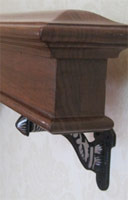 Detail of the bannister with decorative cast bracket.