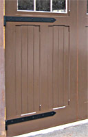 Steel strap hinges completed the carriage house doors.